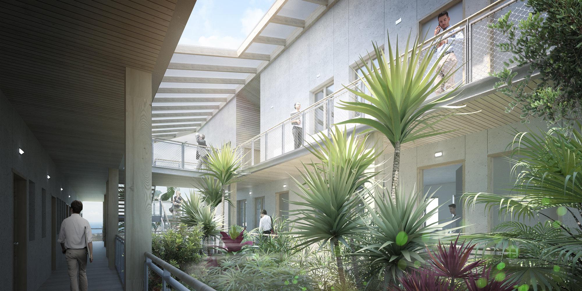 Les espaces de circulation sont extérieurs, autour d’un patio végétal, créant un dialogue constant avec la nature. Les collaborateurs se rencontrent dans des espaces protégés de la pluie et du soleil, créant un véritable lieu d’échanges et de partages, au sein d’un écrin de verdure.